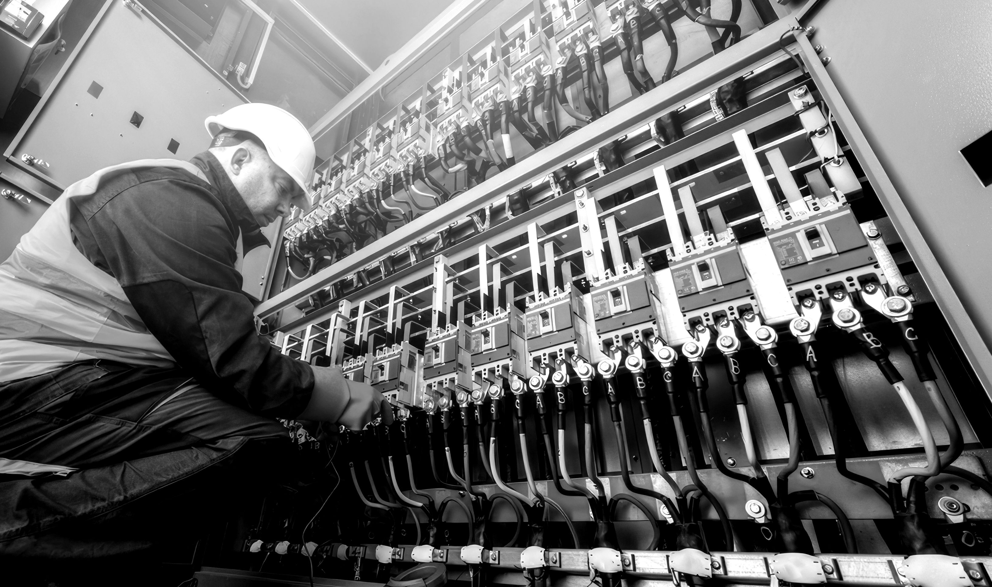 Prima Electric engineer working on a control panel